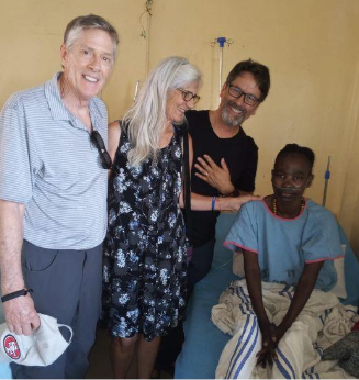 LOMAMO visitors praying with patients at JOOTRH hospital ward